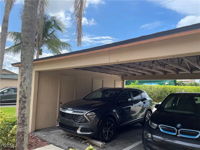 a view of a car parked in back of a building