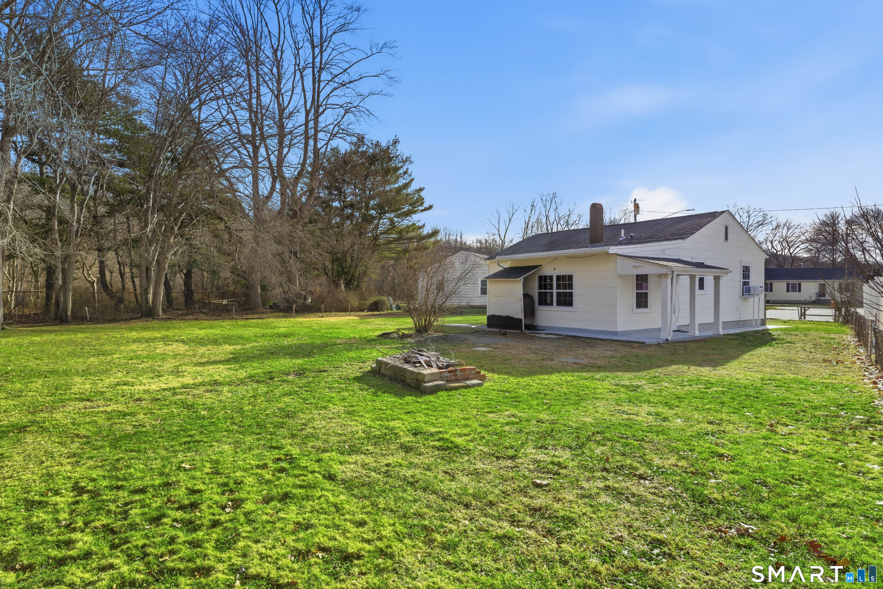 32 Concord Court Groton, CT 06340 - Photo 19 of 24 a big house with a big yard and large trees