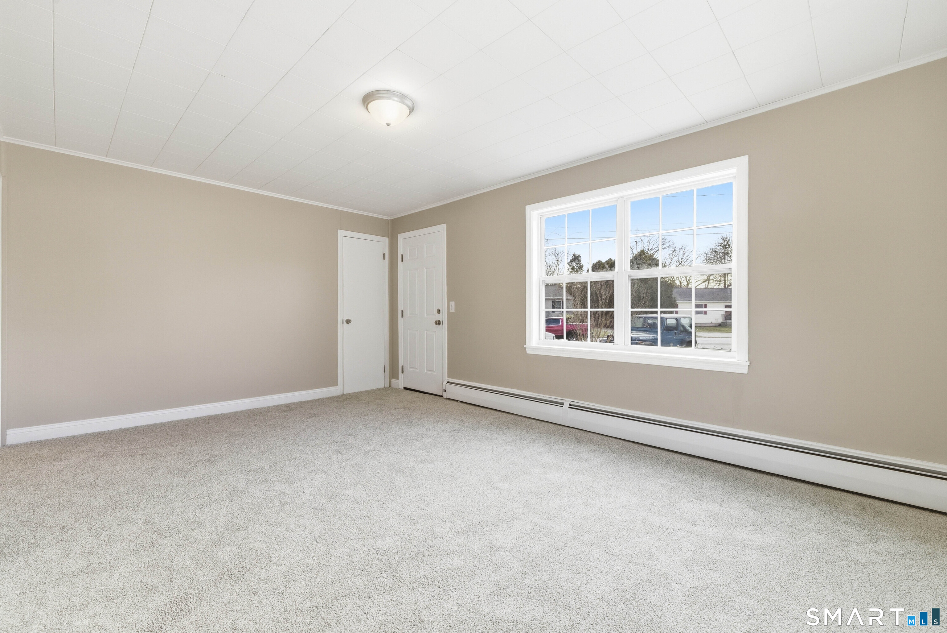 32 Concord Court Groton, CT 06340 - Photo 3 of 24 an empty room with windows