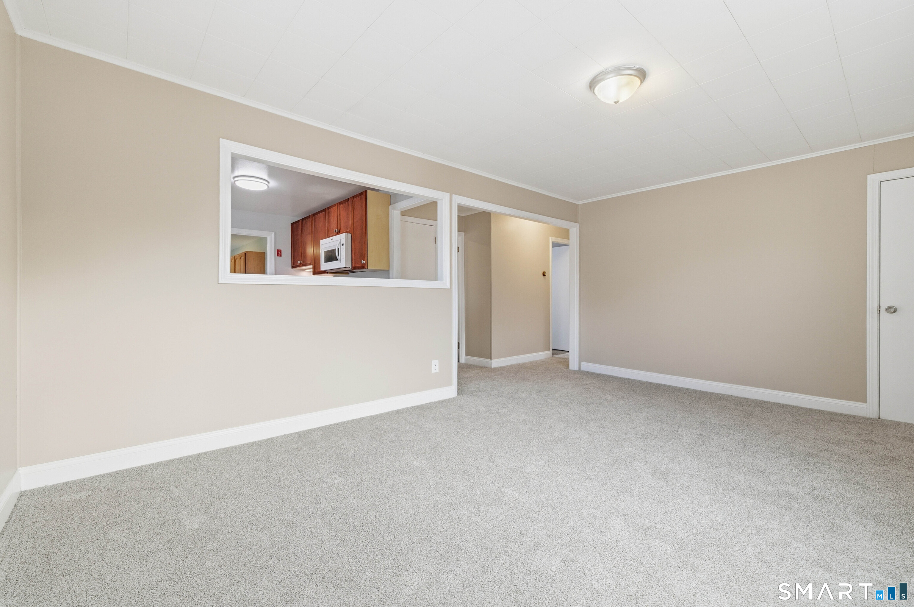32 Concord Court Groton, CT 06340 - Photo 4 of 24 a view of an empty room with a window