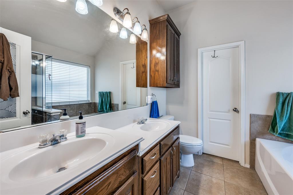 8233 Edgepoint Trail Fort Worth, TX 76053 - Photo 22 of 36 a bathroom with a sink and a mirror