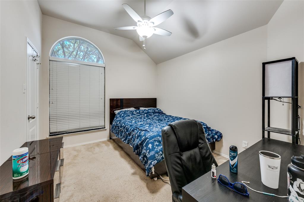 8233 Edgepoint Trail Fort Worth, TX 76053 - Photo 24 of 36 a bedroom with a bed and a chandelier