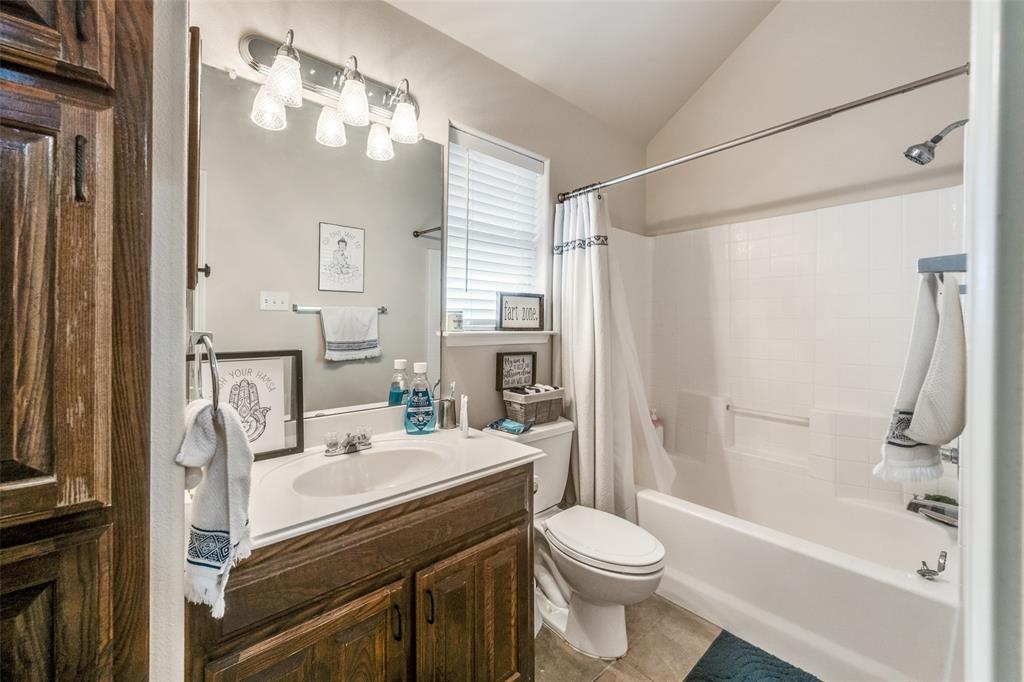 8233 Edgepoint Trail Fort Worth, TX 76053 - Photo 29 of 36 a bathroom with a sink toilet and shower