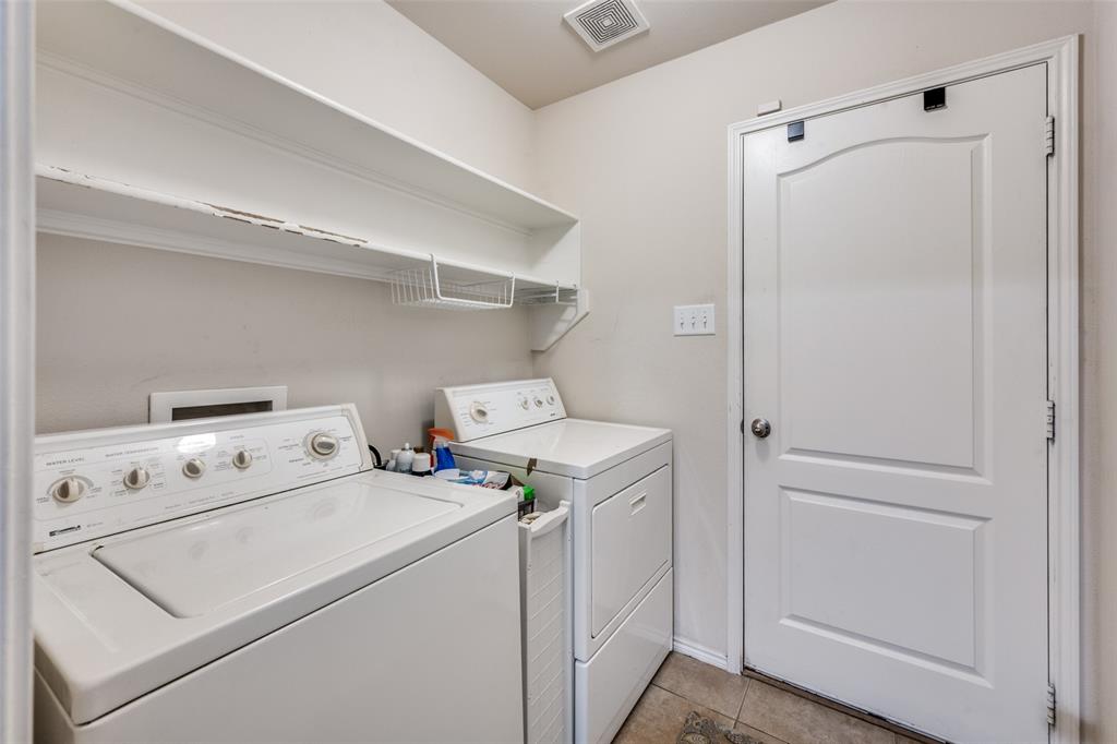 8233 Edgepoint Trail Fort Worth, TX 76053 - Photo 30 of 36 a utility room with dryer and washer