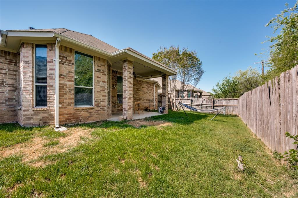 8233 Edgepoint Trail Fort Worth, TX 76053 - Photo 31 of 36 a view of a house with wooden fence