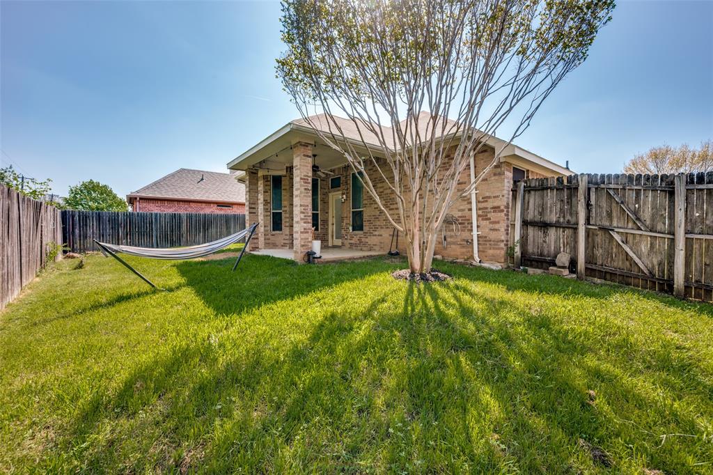 8233 Edgepoint Trail Fort Worth, TX 76053 - Photo 36 of 36 a view of a house with backyard and tree