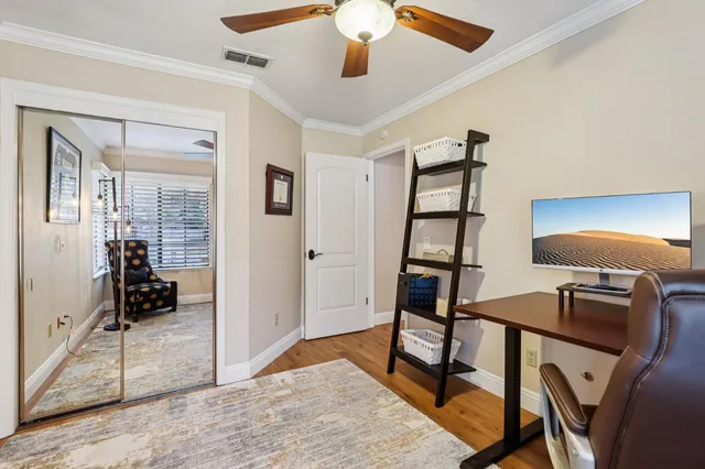 a view of a workspace with furniture and entryway