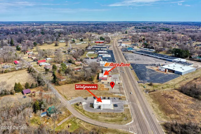 a terrace with outdoor seating and city view
