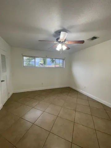 an empty room with a empty space and a window