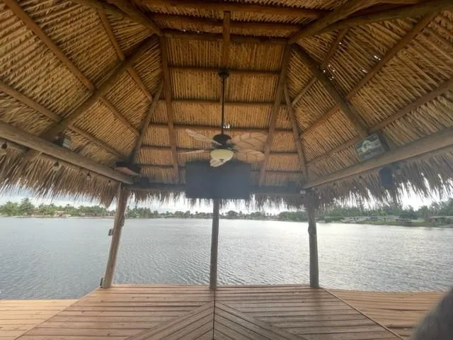 a chair and table sitting in wooden floor