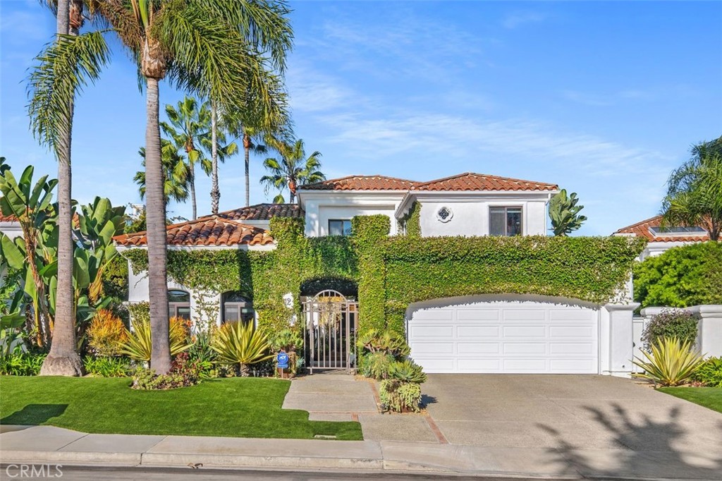12 Terraza Del Mar Dana Point, CA 92629 - Photo 12 of 52 a front view of a house with a yard and garage