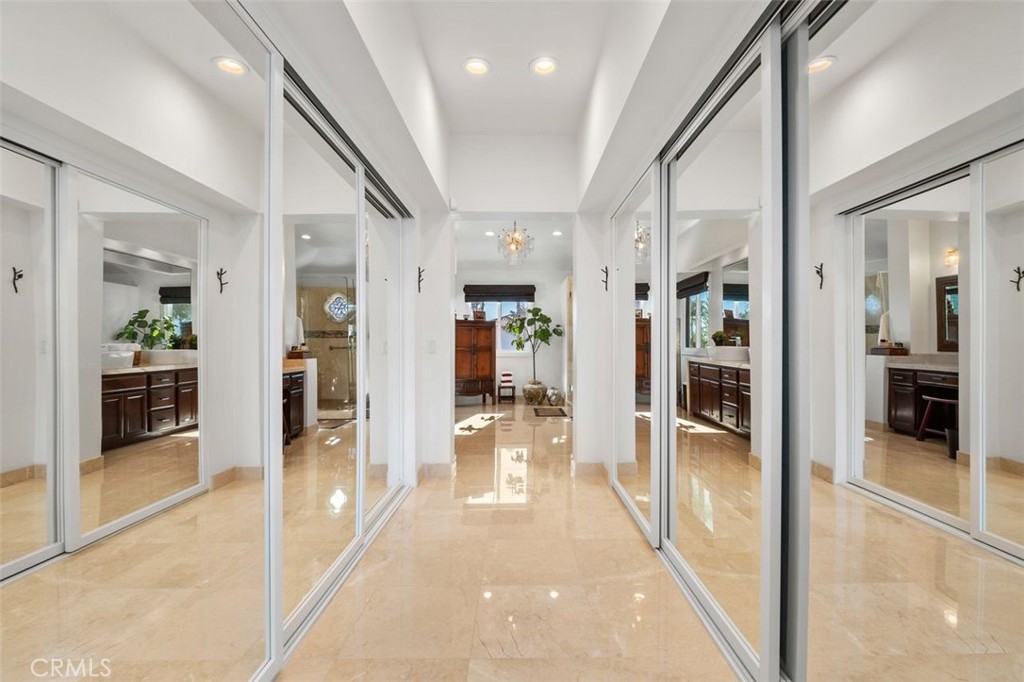 12 Terraza Del Mar Dana Point, CA 92629 - Photo 30 of 52 a view of a hallway with wooden floor and a living room