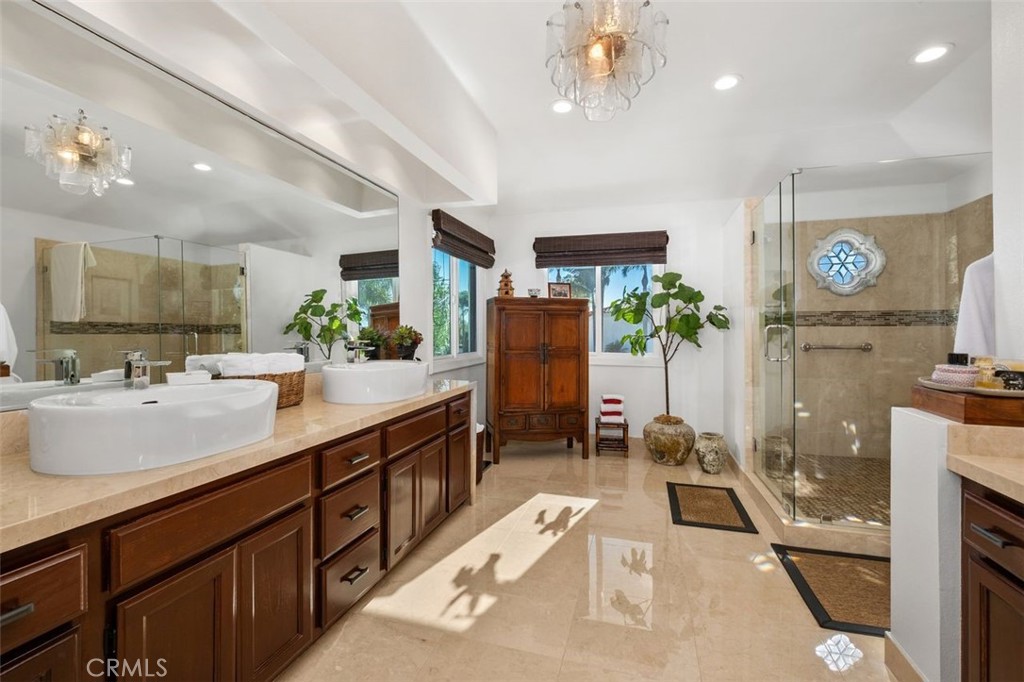 12 Terraza Del Mar Dana Point, CA 92629 - Photo 31 of 52 a spacious bathroom with a sink a mirror and shower