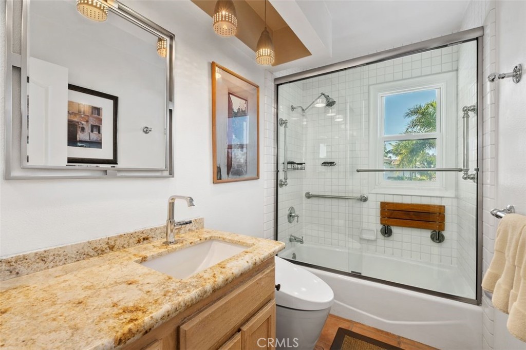 12 Terraza Del Mar Dana Point, CA 92629 - Photo 36 of 52 a bathroom with a granite countertop sink a toilet and shower