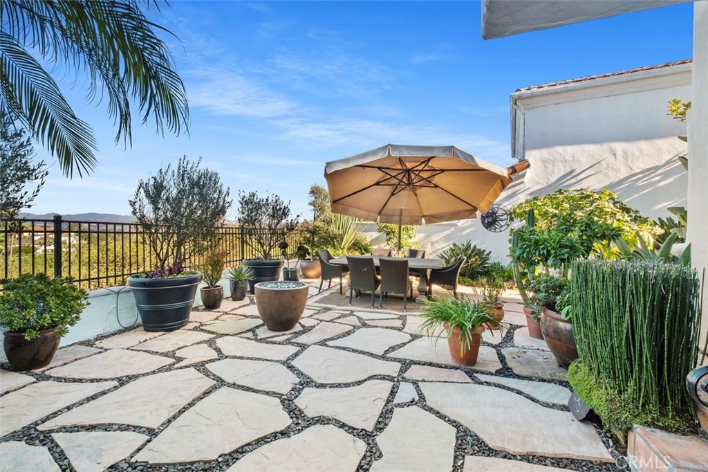 12 Terraza Del Mar Dana Point, CA 92629 - Photo 38 of 52 a view of a patio with chairs and potted plants