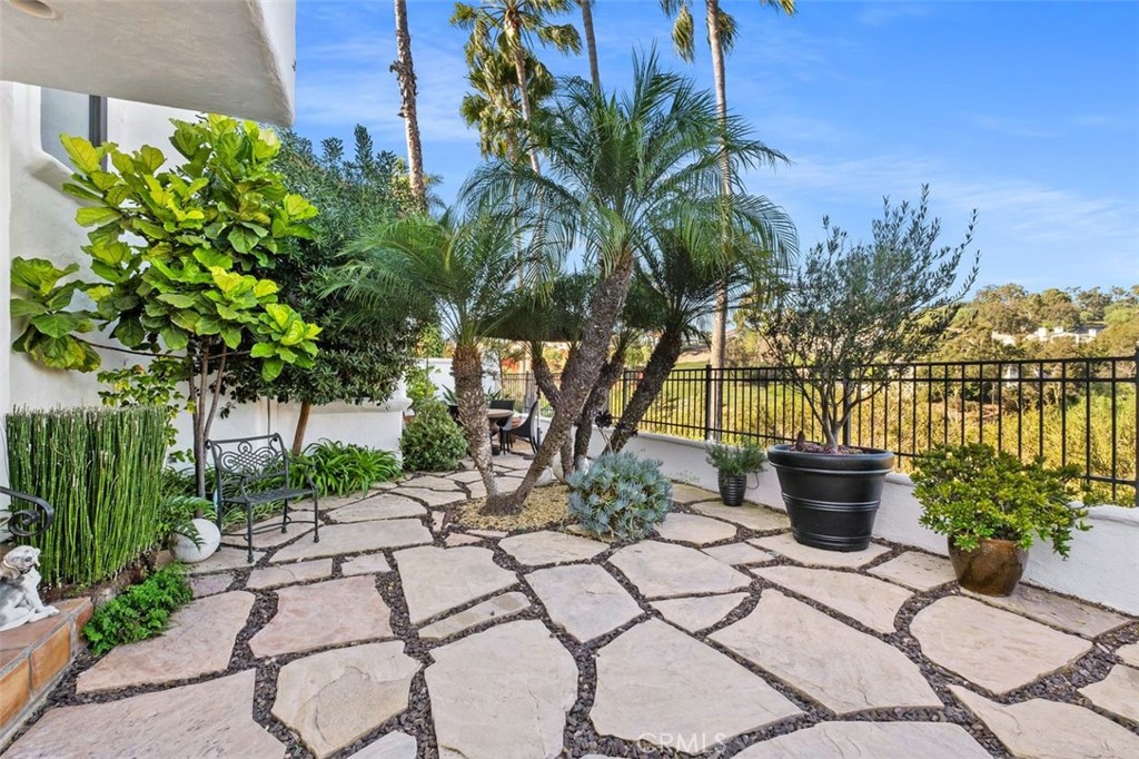 12 Terraza Del Mar Dana Point, CA 92629 - Photo 41 of 52 a view of a backyard with potted plants and water fountain