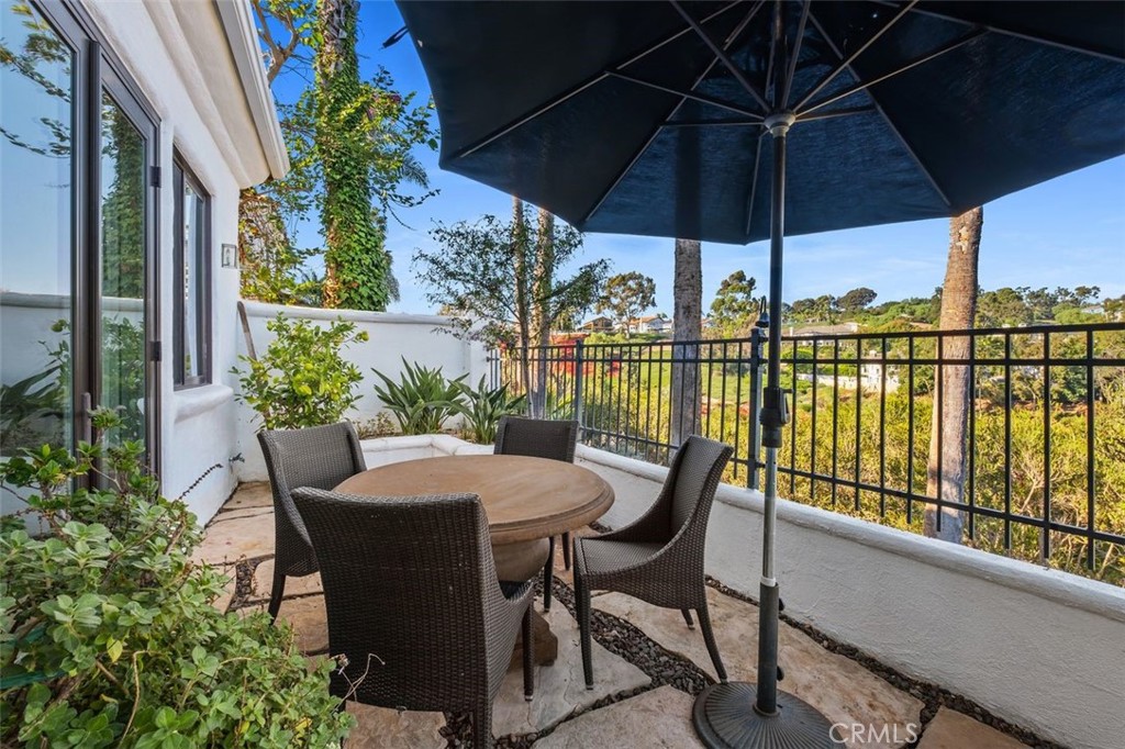 12 Terraza Del Mar Dana Point, CA 92629 - Photo 42 of 52 a view of balcony with furniture and umbrella