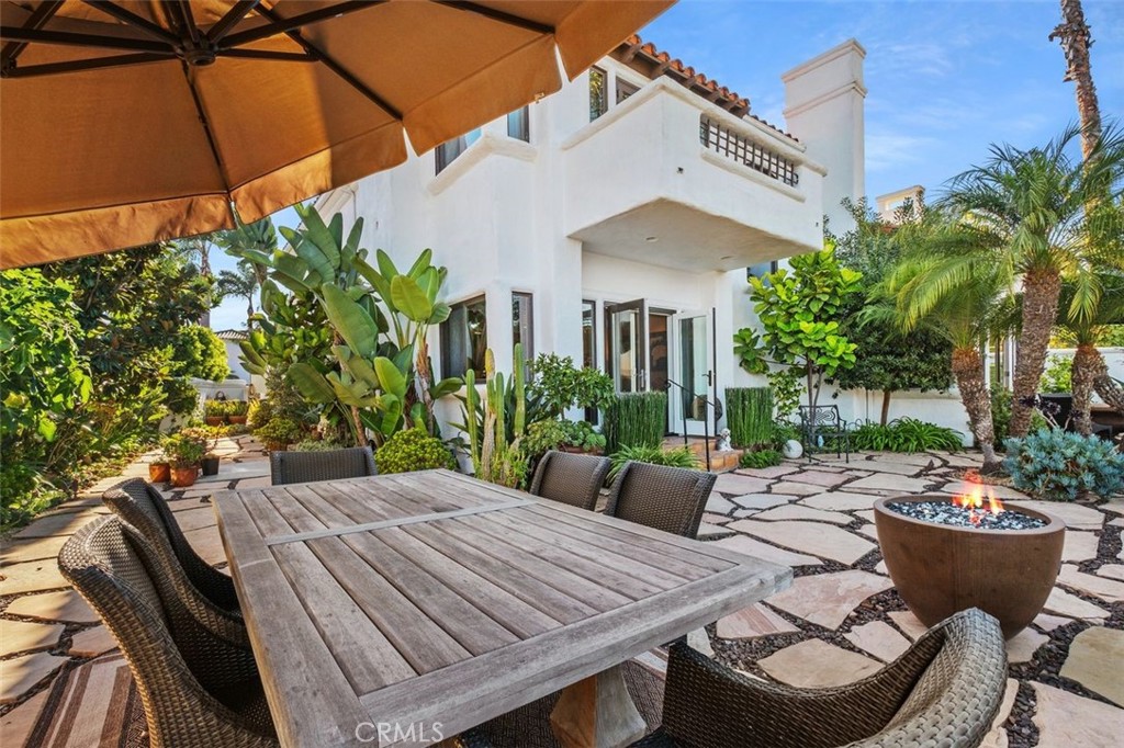 12 Terraza Del Mar Dana Point, CA 92629 - Photo 43 of 52 a view of a patio with table and chairs potted plants