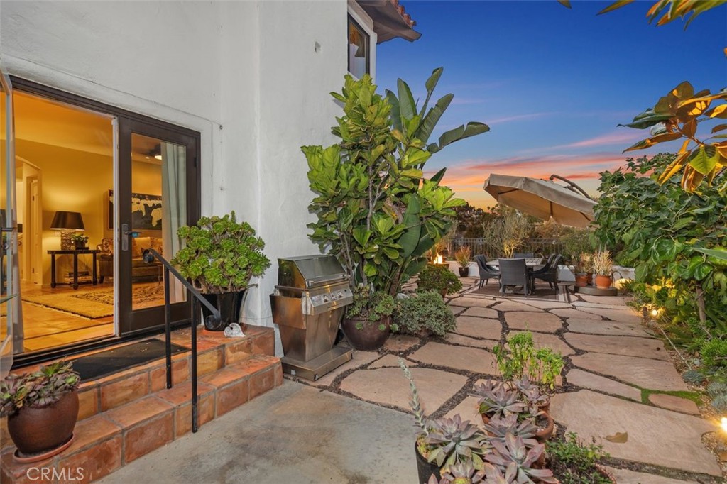 12 Terraza Del Mar Dana Point, CA 92629 - Photo 8 of 52 a potted plant sitting in front of a house