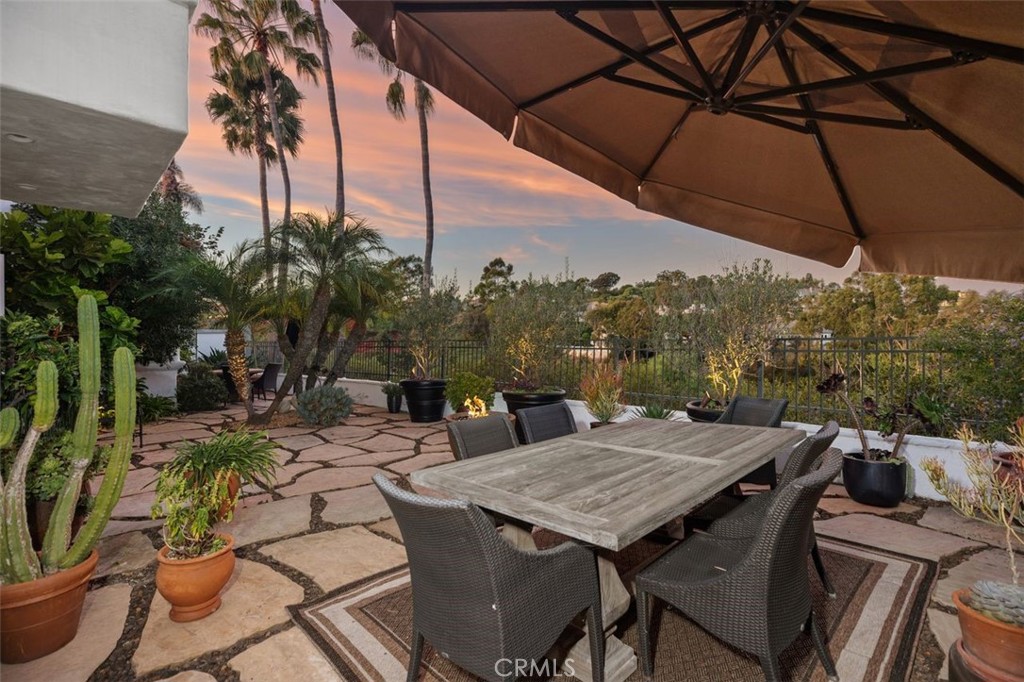 12 Terraza Del Mar Dana Point, CA 92629 - Photo 10 of 52 a view of a patio with table and chairs under an umbrella
