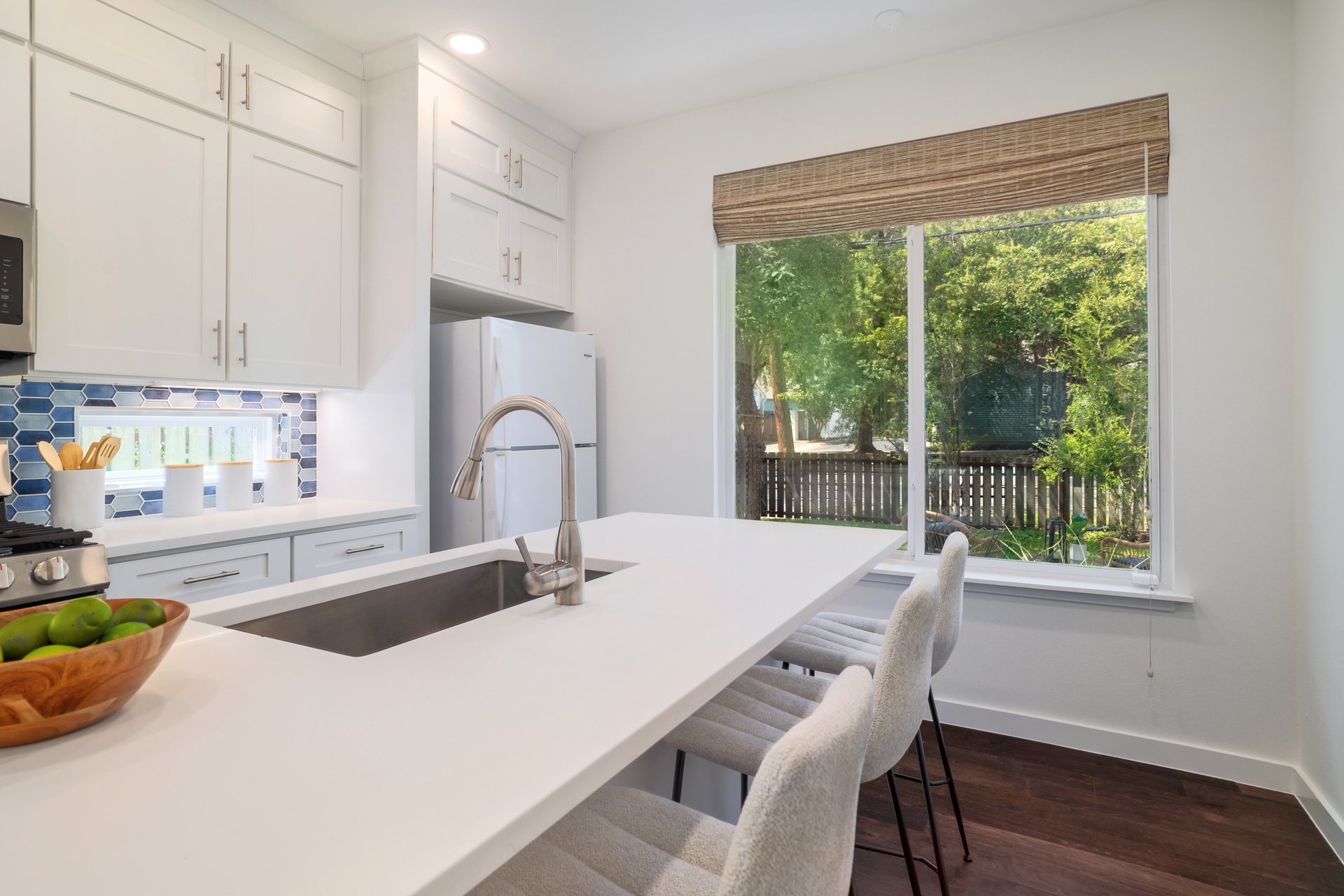 3911 Duval Street, Unit 2 Austin, TX 78751 - Photo 13 of 39 a kitchen with a table chairs and a window