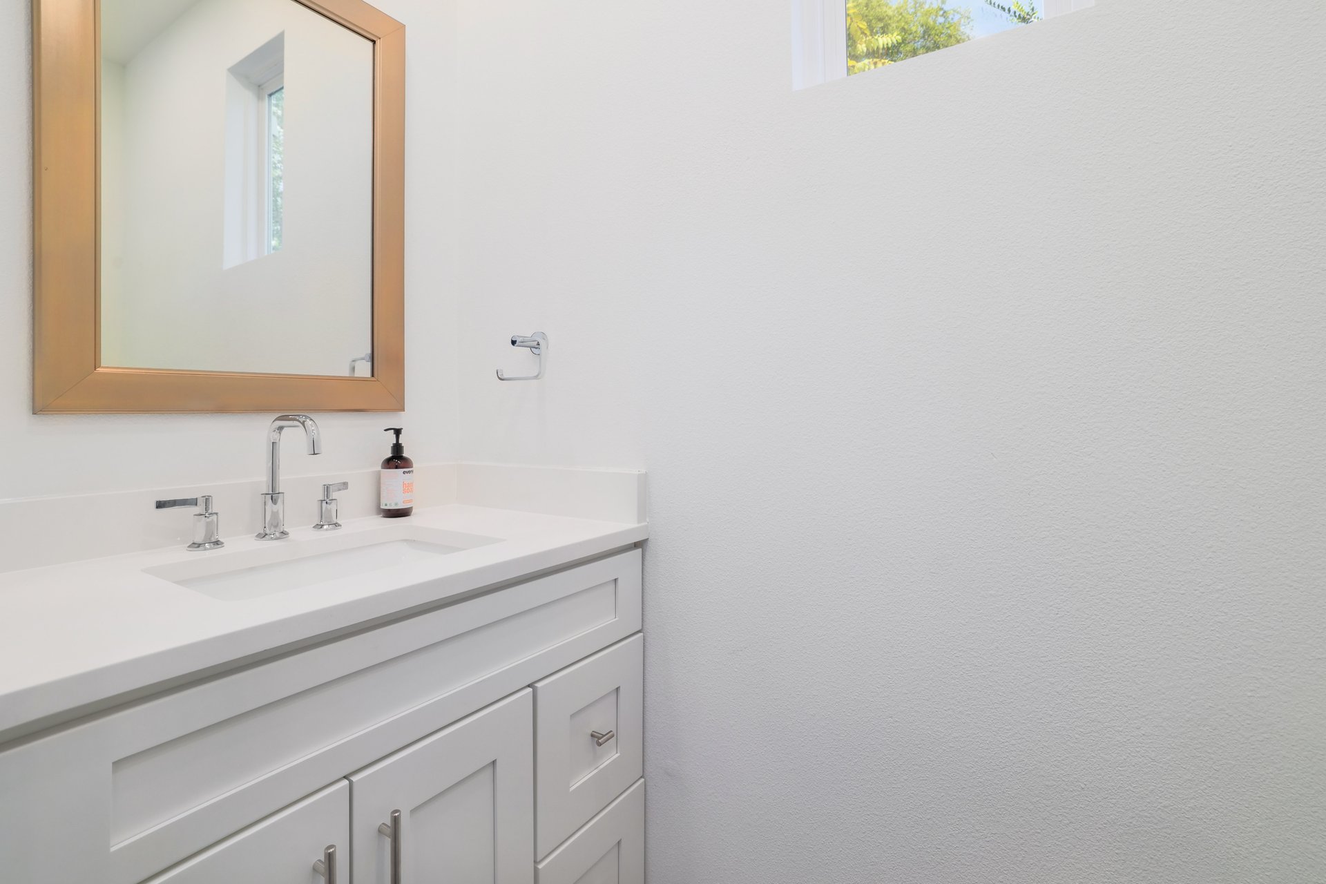 3911 Duval Street, Unit 2 Austin, TX 78751 - Photo 15 of 39 a bathroom with a sink and a mirror