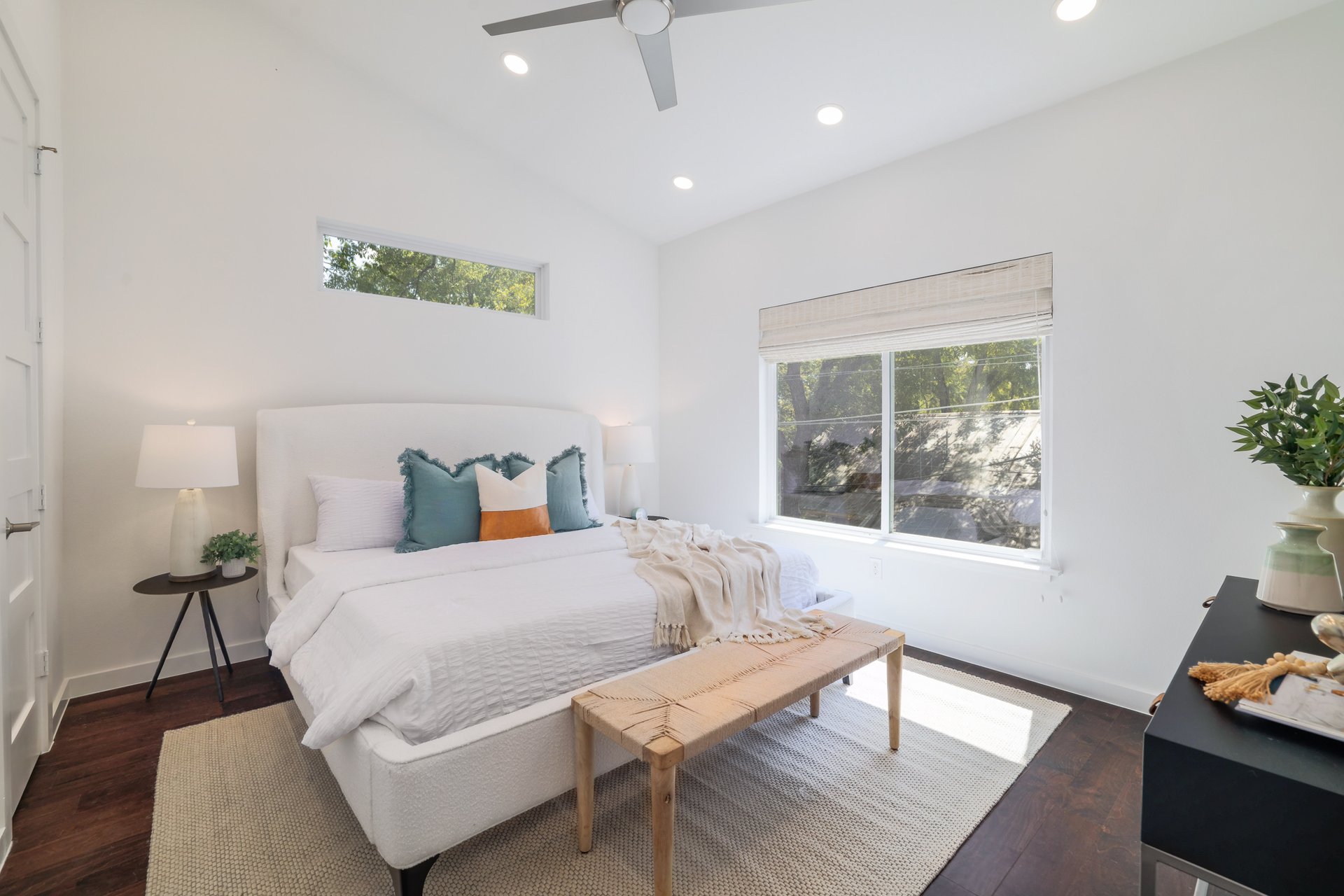 3911 Duval Street, Unit 2 Austin, TX 78751 - Photo 17 of 39 a bedroom with a bed and wooden floor
