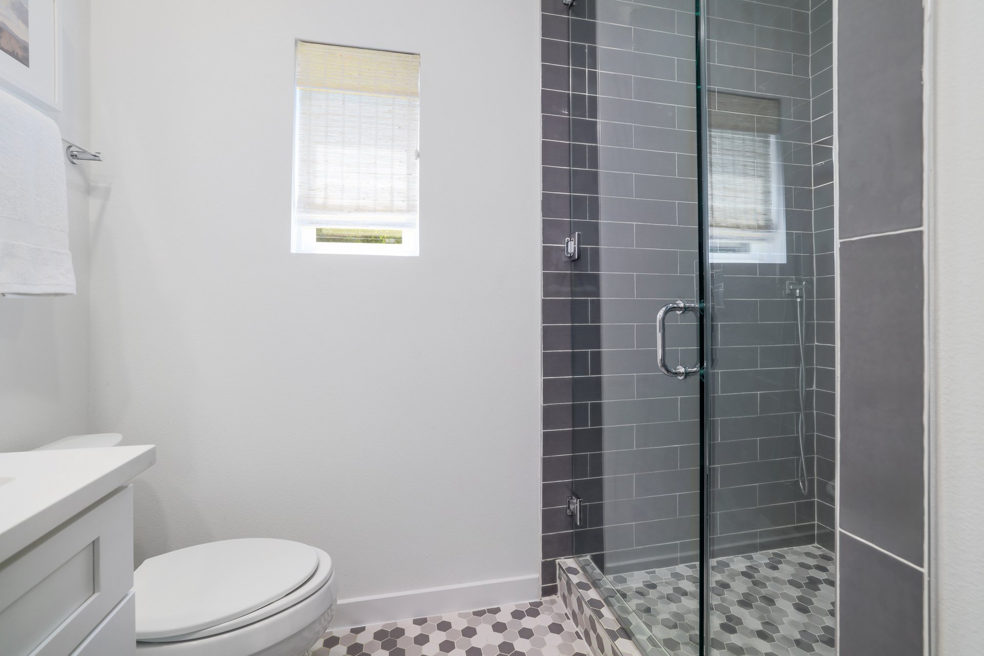 3911 Duval Street, Unit 2 Austin, TX 78751 - Photo 21 of 39 a white toilet sitting next to a shower