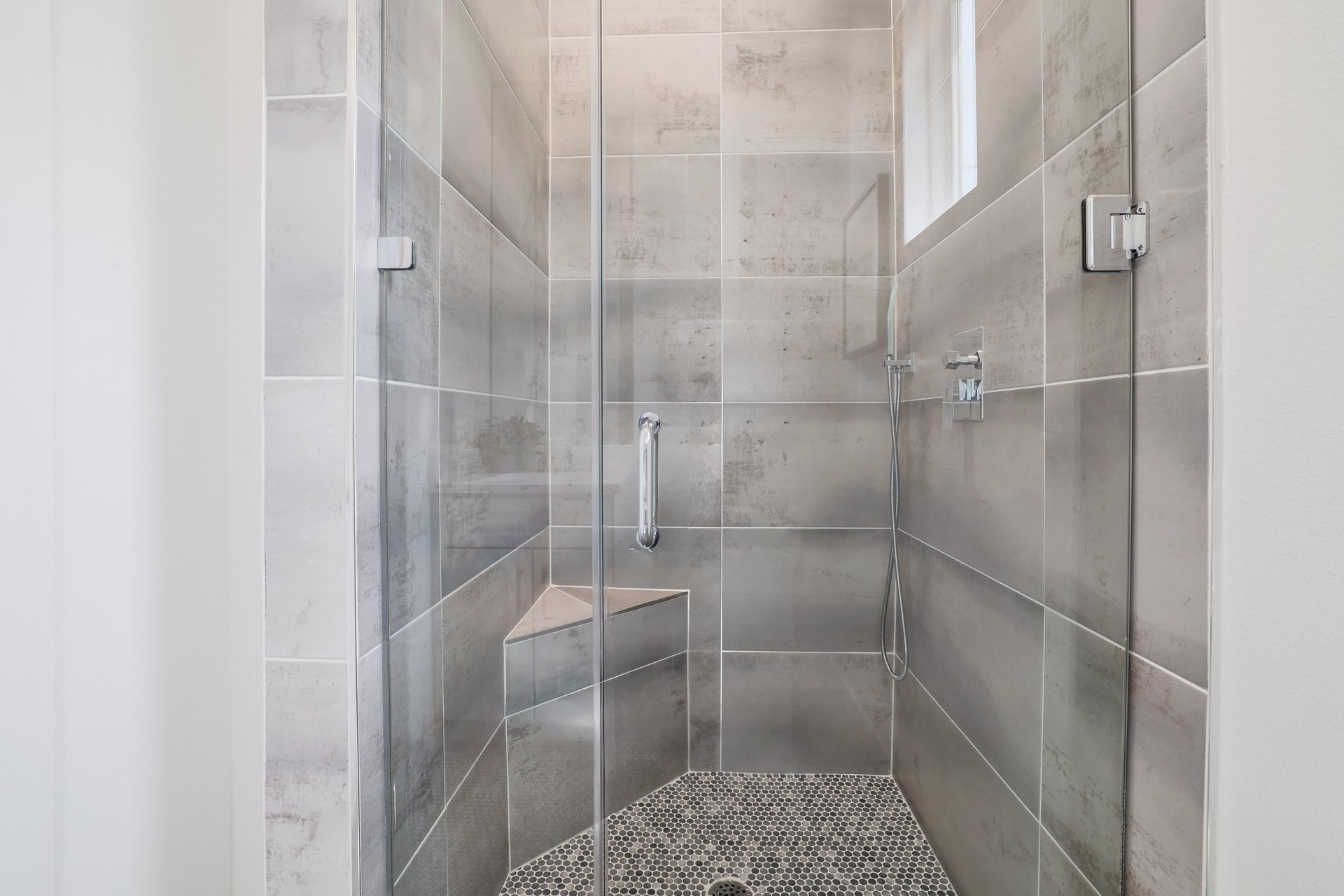 3911 Duval Street, Unit 2 Austin, TX 78751 - Photo 25 of 39 a bathroom with a glass shower door