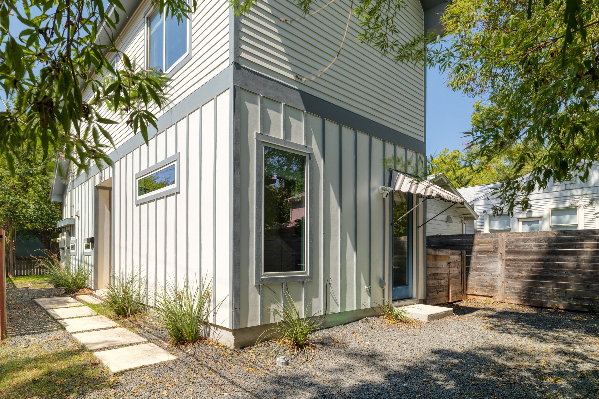 3911 Duval Street, Unit 2 Austin, TX 78751 - Photo 26 of 39 a front view of a house with a yard