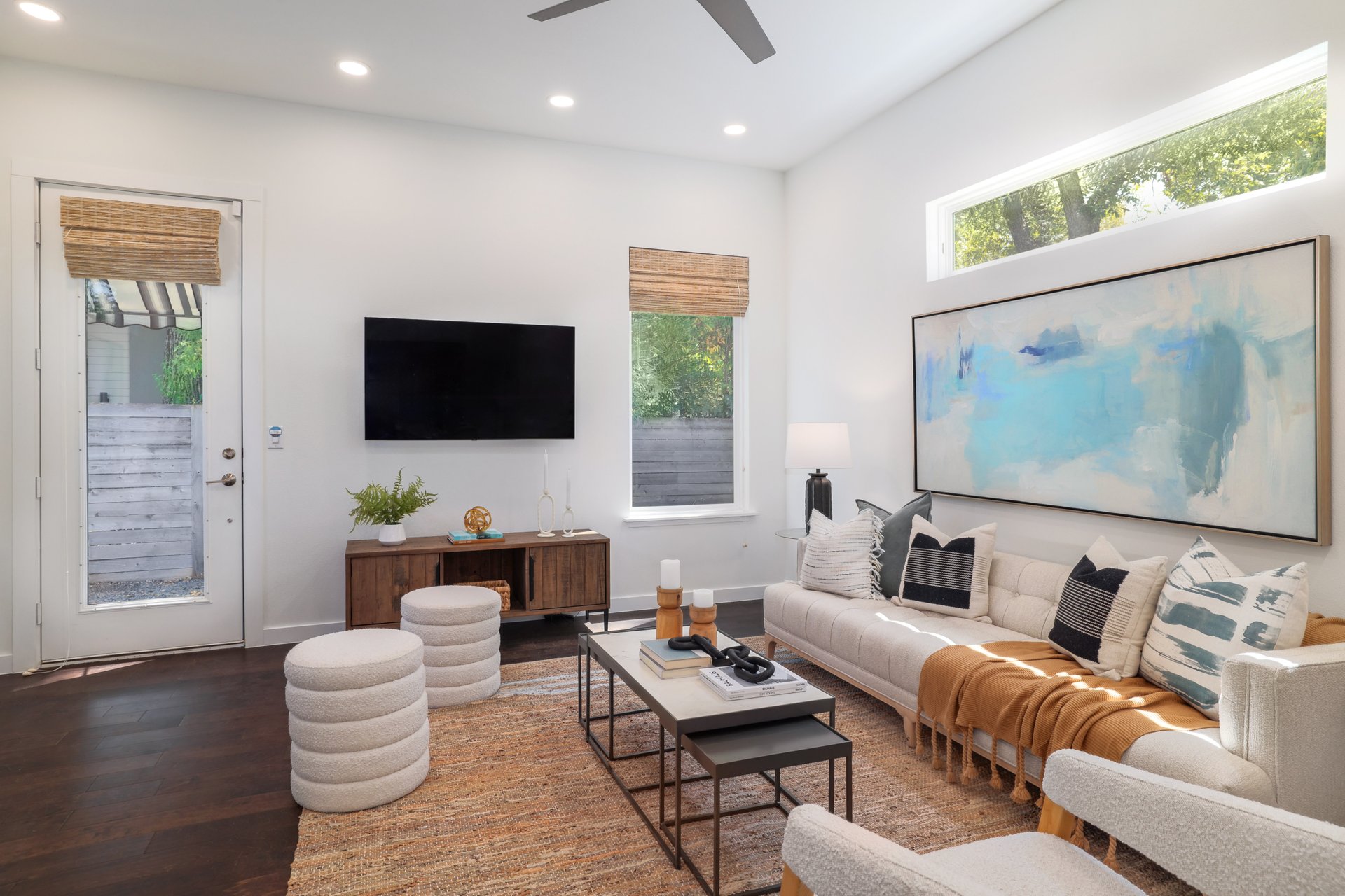3911 Duval Street, Unit 2 Austin, TX 78751 - Photo 6 of 39 a living room with furniture a flat screen tv and wooden floor