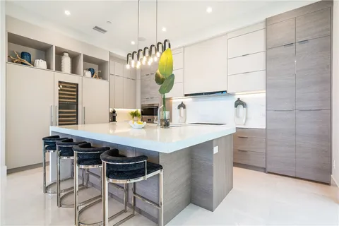 a kitchen with a sink cabinets and window