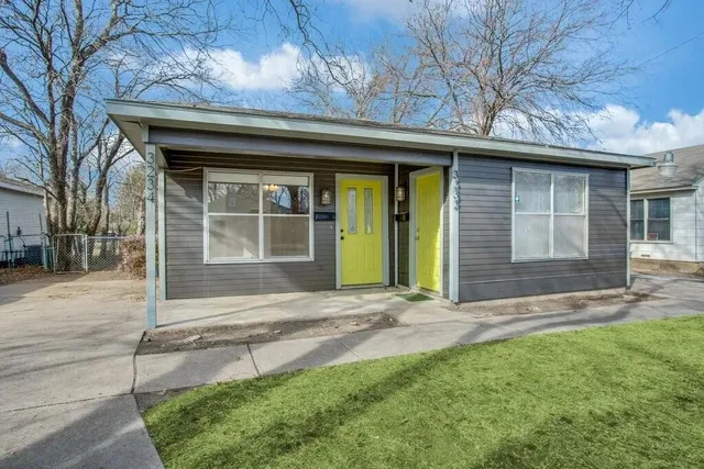 a view of house with yard