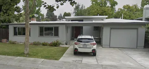 a car parked in front of a house