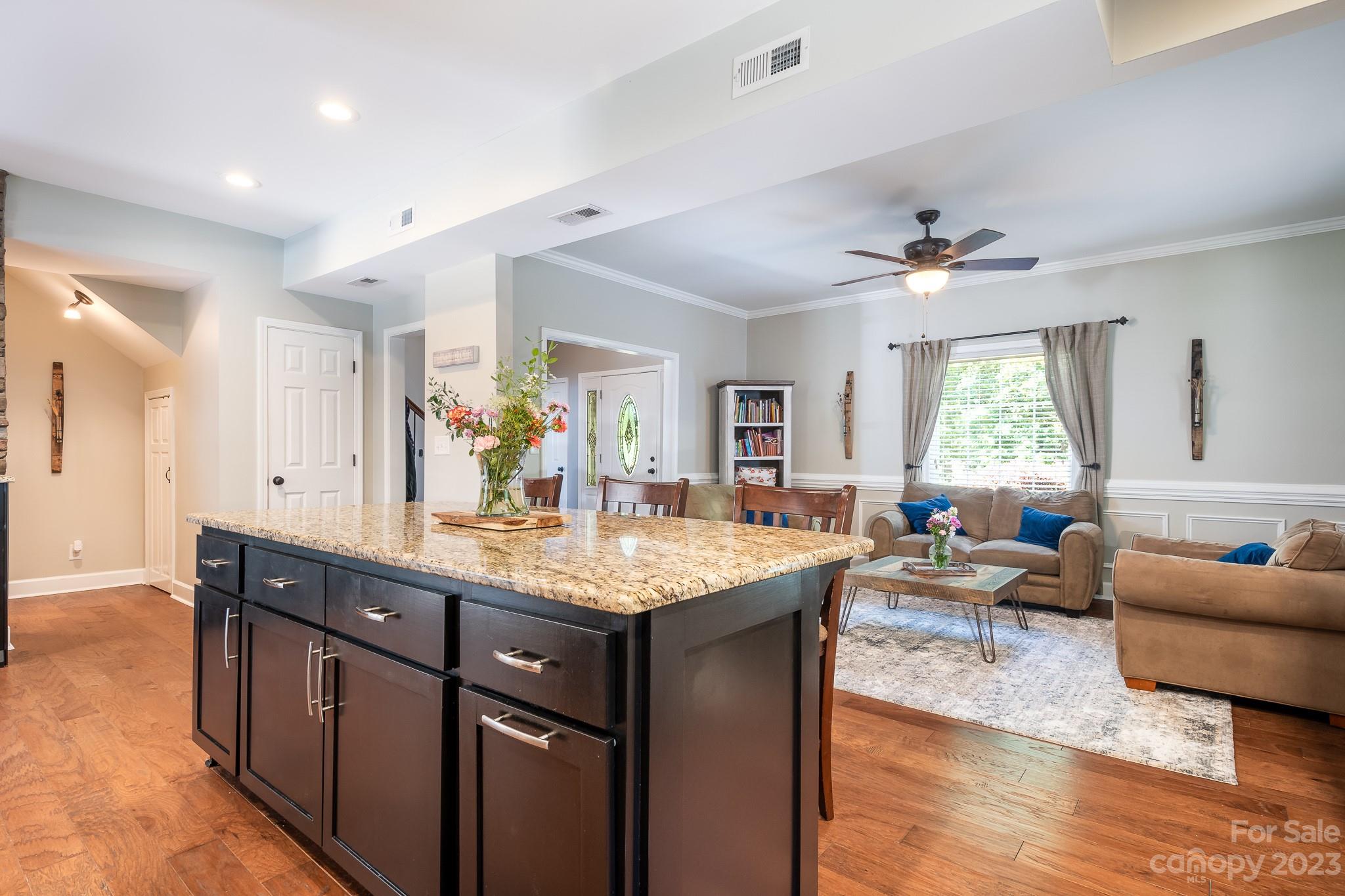3119 Lake Shore Road South Denver, NC 28037 - Photo 15 of 35 a living room with stainless steel appliances kitchen island granite countertop furniture a large window and a sink