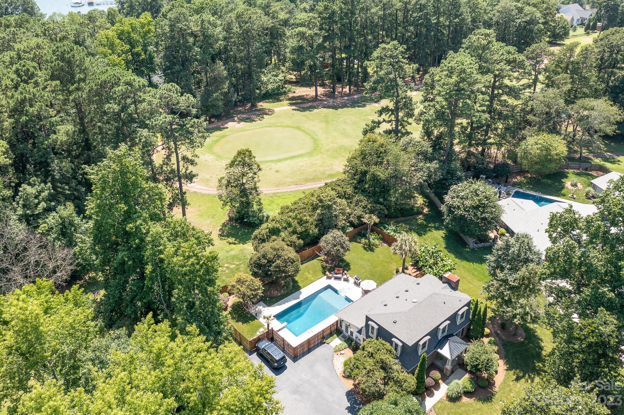 3119 Lake Shore Road South Denver, NC 28037 - Photo 30 of 35 an aerial view of a house with swimming pool and garden