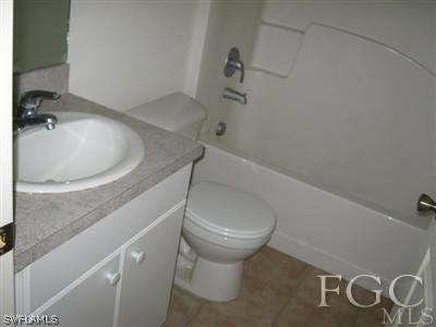 101 Meadow Road Lehigh Acres, FL 33973 - Photo 3 of 4 a bathroom with a sink and toilet