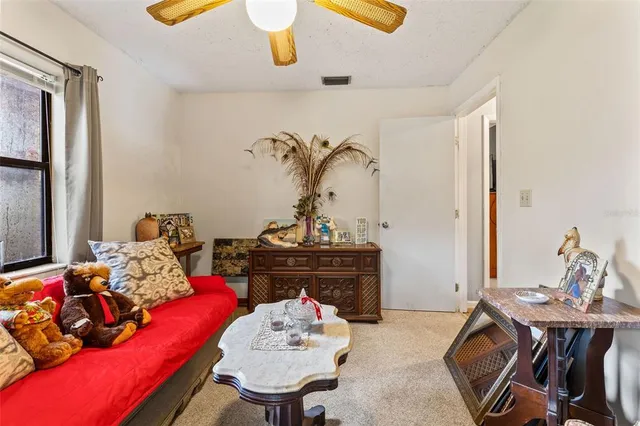 a bedroom with a bed and a television