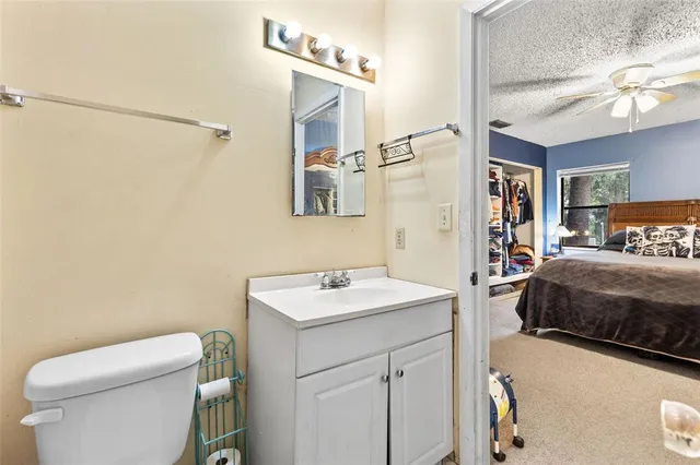 a bedroom with furniture and a large window