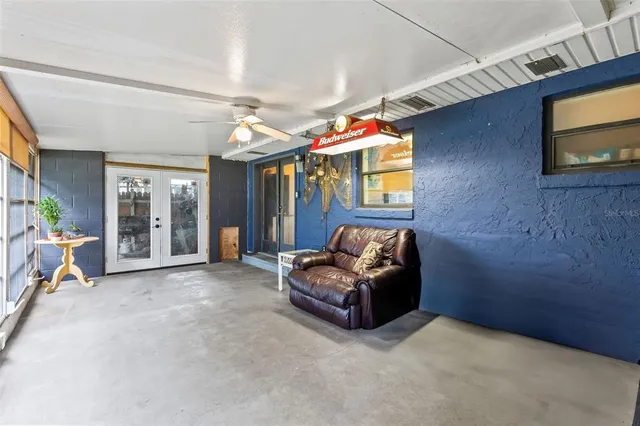 a view of backyard with wooden fence