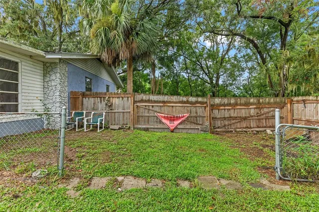 a view of a garden with a building in the background