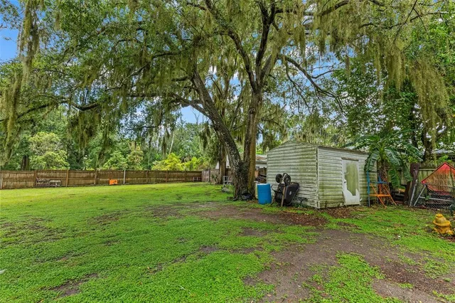 a backyard of a house with lots of green space