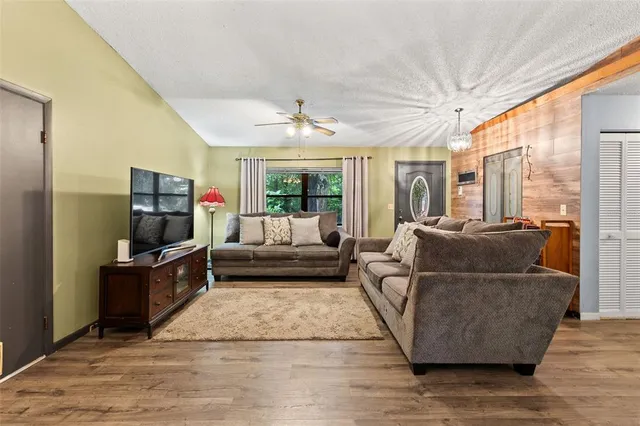 a living room with a couch and a flat screen tv