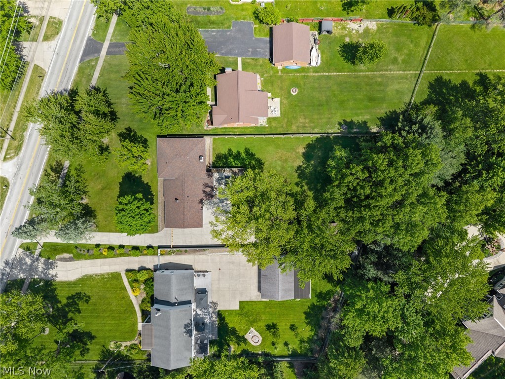 17583 Shurmer Road Strongsville, OH 44136 - Photo 50 of 50 Aerial view showcasing a property featuring a gray shingle roof and a paved driveway