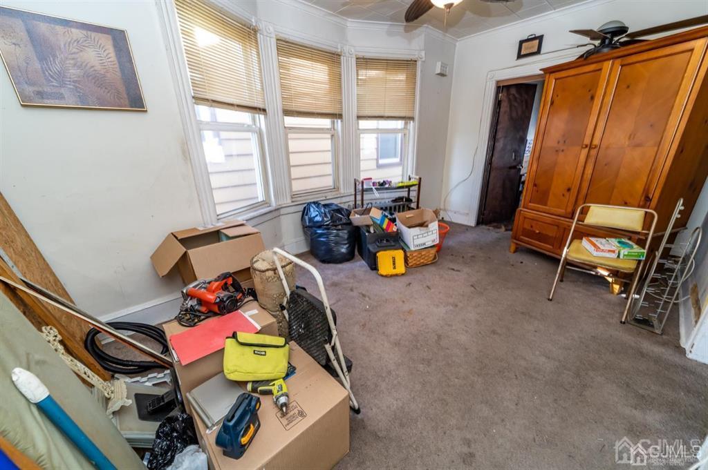 28 Niles Street Elizabeth, NJ 07202 - Photo 20 of 35 a living room with furniture and a window