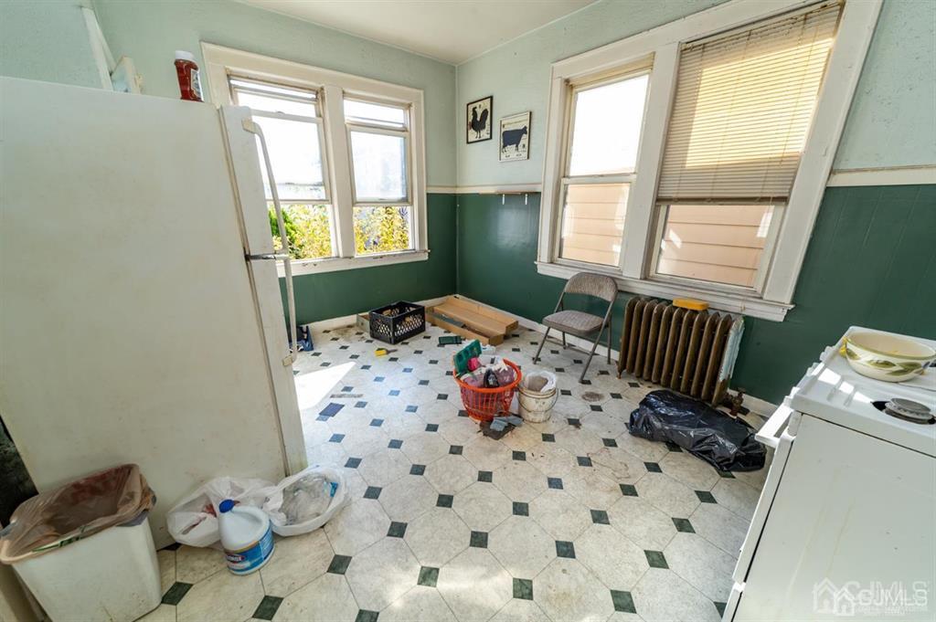 28 Niles Street Elizabeth, NJ 07202 - Photo 22 of 35 a bedroom with a bed and a window