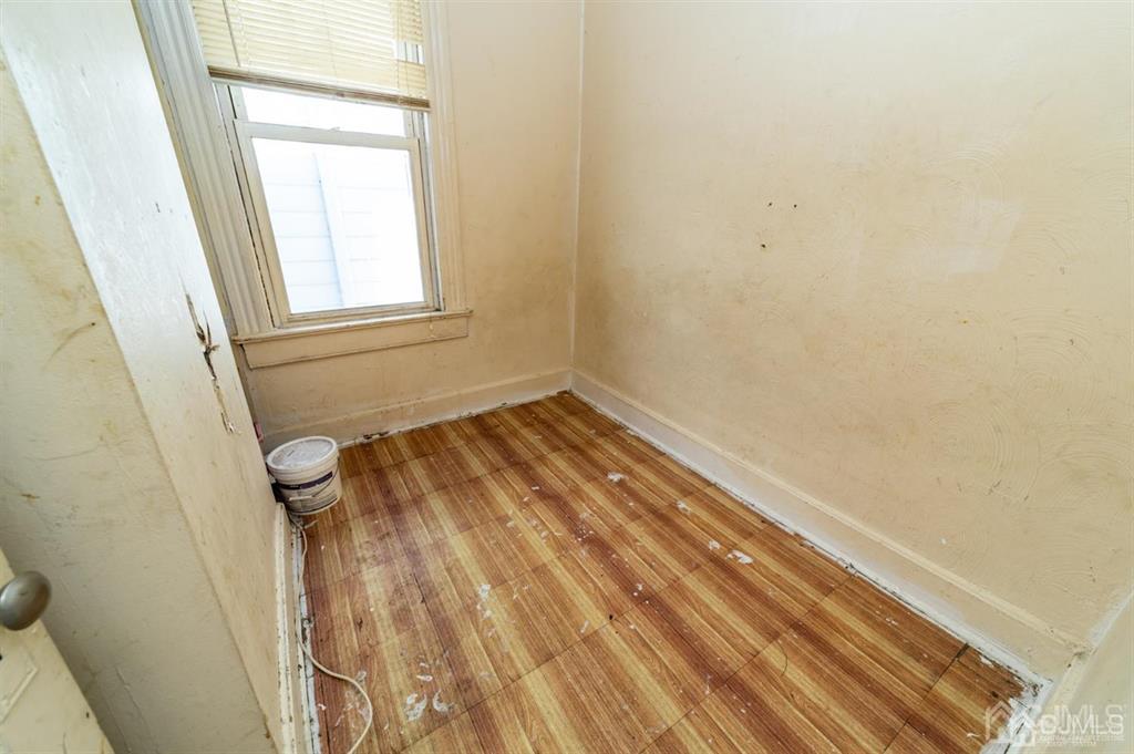 28 Niles Street Elizabeth, NJ 07202 - Photo 24 of 35 a view of a small space with wooden floor and a window