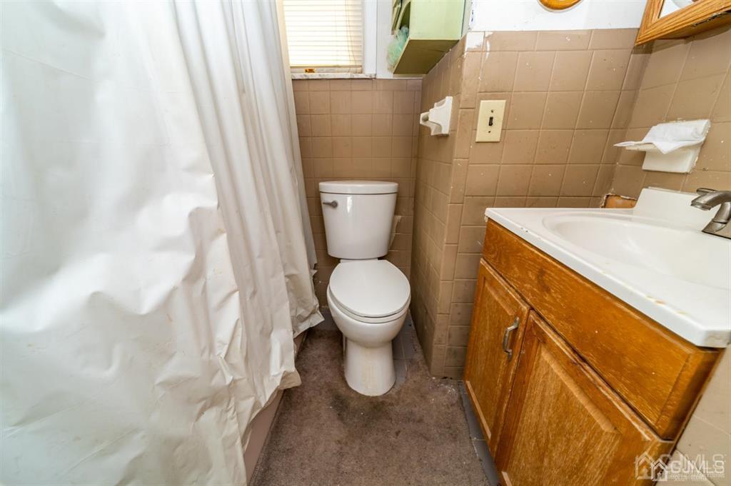 28 Niles Street Elizabeth, NJ 07202 - Photo 25 of 35 a bathroom with a sink and a toilet