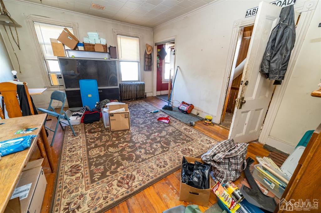28 Niles Street Elizabeth, NJ 07202 - Photo 26 of 35 a living room with furniture and a wooden floor