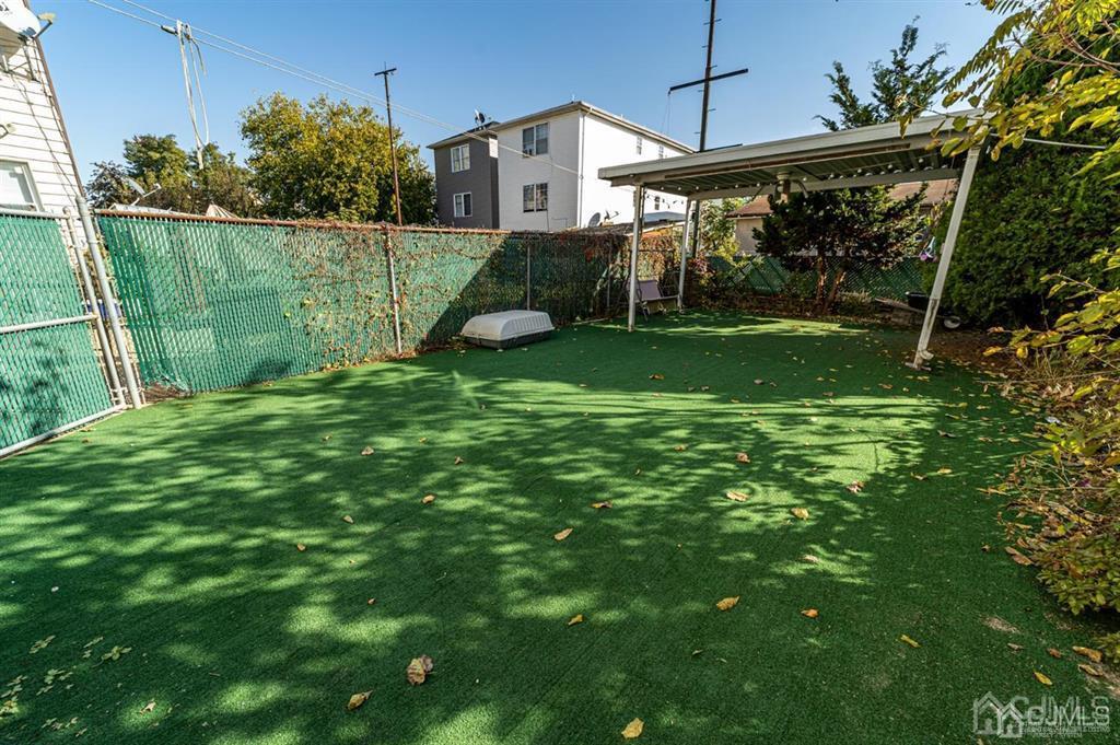 28 Niles Street Elizabeth, NJ 07202 - Photo 33 of 35 a view of a house with a yard